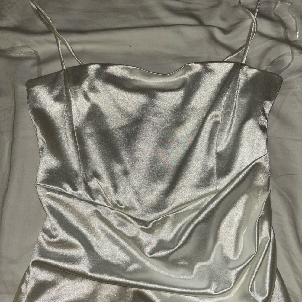 short white satin dress, ruched at the stomach, slight leg slit